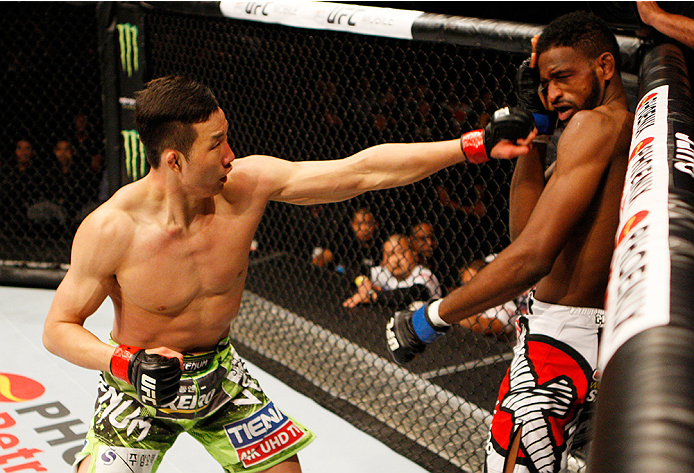 MANILA, PHILIPPINES - MAY 16: Hyun Gyu Lim of South Korea punches Neil Magny of the United States in their welterweight fight during the UFC Fight Night event at the Mall of Asia Arena on May 16, 2015 in Manila, Philippines. (Photo by Mitch Viquez/Zuffa