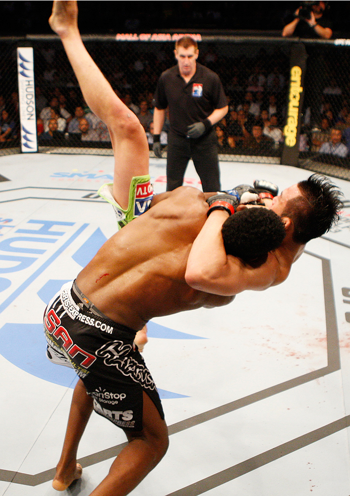 MANILA, PHILIPPINES - MAY 16: Neil Magny of the United States takes down Hyun Gyu Lim of South Korea in their welterweight fight during the UFC Fight Night event at the Mall of Asia Arena on May 16, 2015 in Manila, Philippines. (Photo by Mitch Viquez/Zuf