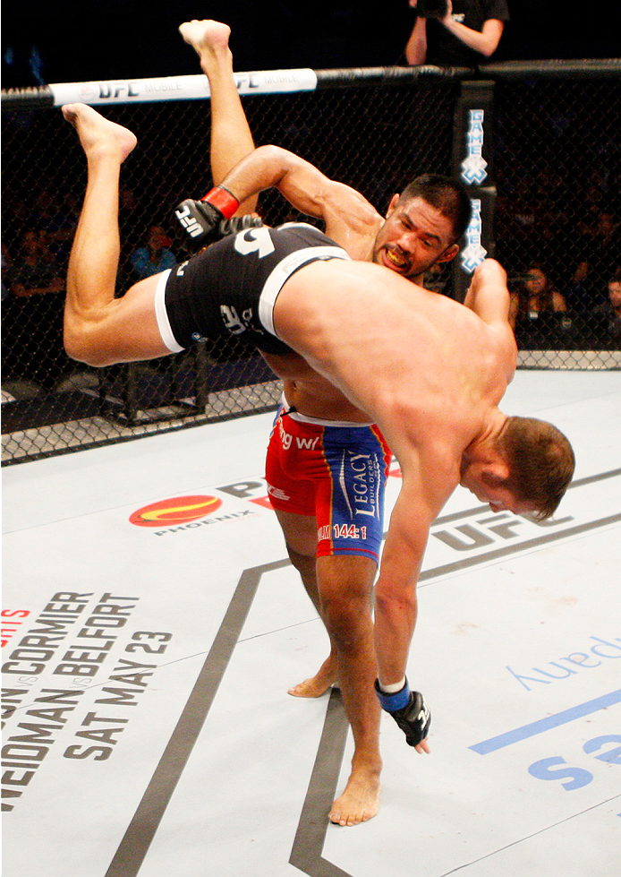 MANILA, PHILIPPINES - MAY 16: Mark Munoz of the United States takes down Luke Barnatt of England in their middleweight fight during the UFC Fight Night event at the Mall of Asia Arena on May 16, 2015 in Manila, Philippines. (Photo by Mitch Viquez/Zuffa LL