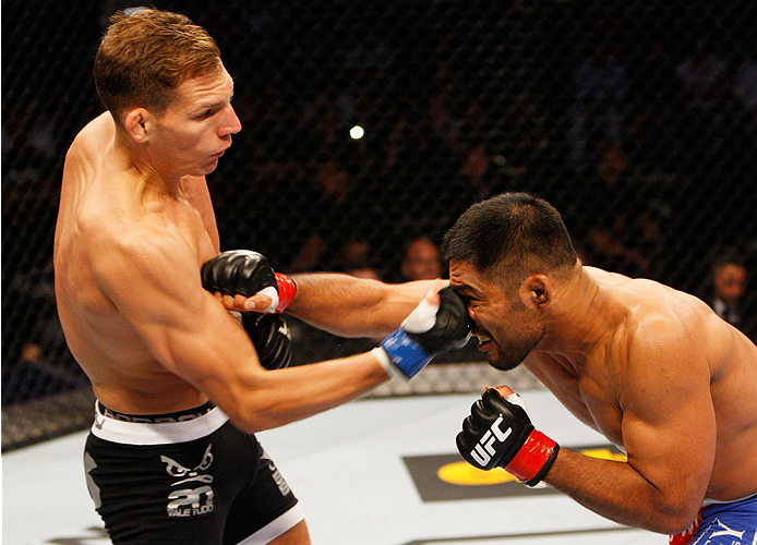 MANILA, PHILIPPINES - MAY 16: Luke Barnatt of England lands a punch on Mark Munoz of the United States in their middleweight fight during the UFC Fight Night event at the Mall of Asia Arena on May 16, 2015 in Manila, Philippines. (Photo by Mitch Viquez/Z
