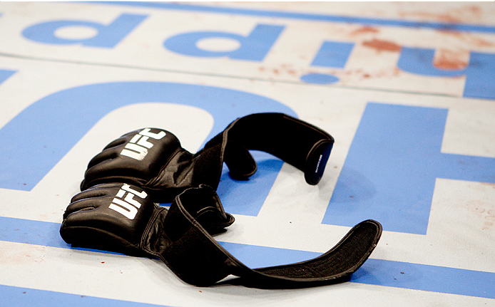 MANILA, PHILIPPINES - MAY 16: Mark Munoz of the United States after his win, retires from the UFC, leaving his gloves in the middle of the octagon during the UFC Fight Night event at the Mall of Asia Arena on May 16, 2015 in Manila, Philippines. (Photo by