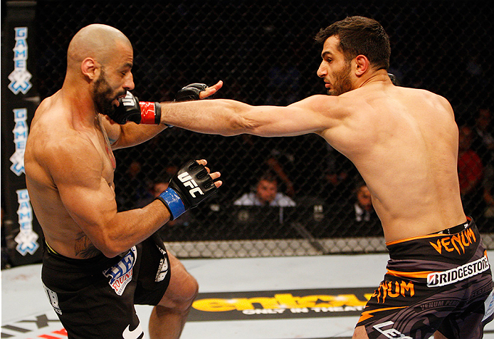 MANILA, PHILIPPINES - MAY 16: Gegard Mousasi of the Netherlands punches Costas Philippou of the United States in their middleweight fight during the UFC Fight Night event at the Mall of Asia Arena on May 16, 2015 in Manila, Philippines. (Photo by Mitch Vi