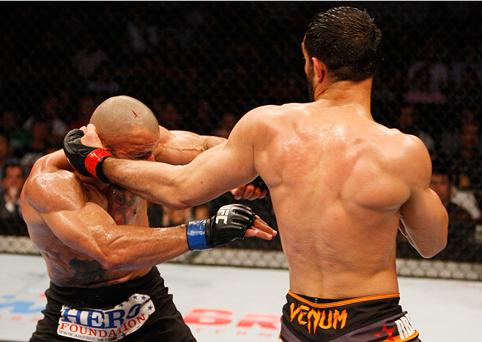 MANILA, PHILIPPINES - MAY 16: Gegard Mousasi of the Netherlands punches Costas Philippou of the United States in their middleweight fight during the UFC Fight Night event at the Mall of Asia Arena on May 16, 2015 in Manila, Philippines. (Photo by Mitch V