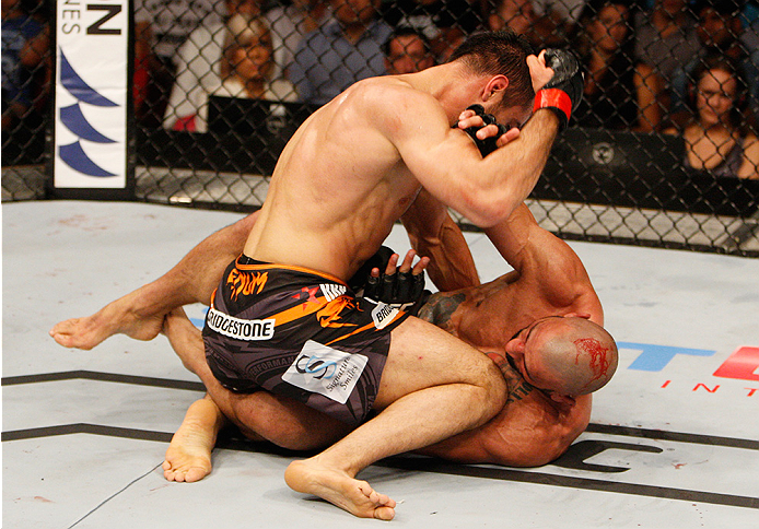 MANILA, PHILIPPINES - MAY 16: Gegard Mousasi of the Netherlands throws elbows at Costas Philippou of the United States in their middleweight fight during the UFC Fight Night event at the Mall of Asia Arena on May 16, 2015 in Manila, Philippines. (Photo by