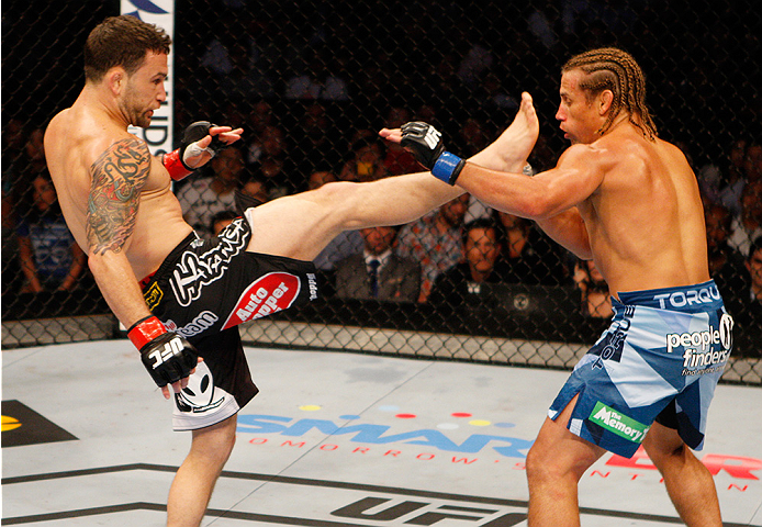 MANILA, PHILIPPINES - MAY 16: Frankie Edgar of the United States throws a kick at Uriah Faber of the United States in their featherweight fight during the UFC Fight Night event at the Mall of Asia Arena on May 16, 2015 in Manila, Philippines. (Photo by Mi