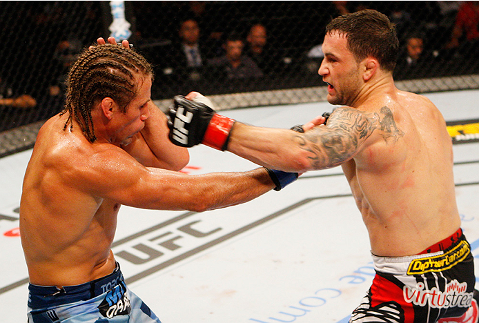 MANILA, PHILIPPINES - MAY 16: Frankie Edgar of the United States throws a punch at Uriah Faber of the United States in their featherweight fight during the UFC Fight Night event at the Mall of Asia Arena on May 16, 2015 in Manila, Philippines. (Photo by M