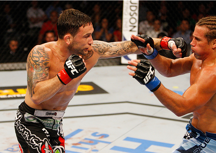 MANILA, PHILIPPINES - MAY 16: Frankie Edgar of the United States throws a punch at Uriah Faber of the United States in their featherweight fight during the UFC Fight Night event at the Mall of Asia Arena on May 16, 2015 in Manila, Philippines. (Photo by M