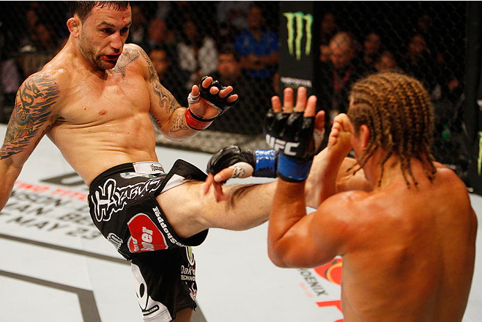 MANILA, PHILIPPINES - MAY 16: Frankie Edgar of the United States throws a kick at Uriah Faber of the United States in their featherweight fight during the UFC Fight Night event at the Mall of Asia Arena on May 16, 2015 in Manila, Philippines. (Photo by Mi