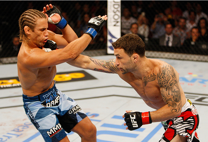 MANILA, PHILIPPINES - MAY 16: Frankie Edgar of the United States throws a punch at Uriah Faber of the United States in their featherweight fight during the UFC Fight Night event at the Mall of Asia Arena on May 16, 2015 in Manila, Philippines. (Photo by M
