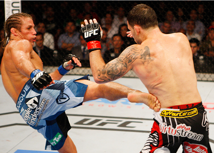MANILA, PHILIPPINES - MAY 16: Uriah Faber of the United States throws a kick at Frankie Edgar of the United States in their featherweight fight during the UFC Fight Night event at the Mall of Asia Arena on May 16, 2015 in Manila, Philippines. (Photo by Mi