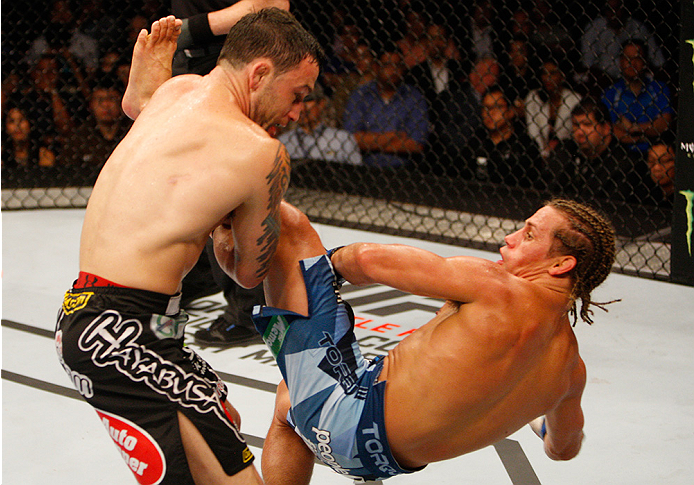 MANILA, PHILIPPINES - MAY 16: Frankie Edgar of the United States takes down Uriah Faber of the United States in their featherweight fight during the UFC Fight Night event at the Mall of Asia Arena on May 16, 2015 in Manila, Philippines. (Photo by Mitch V