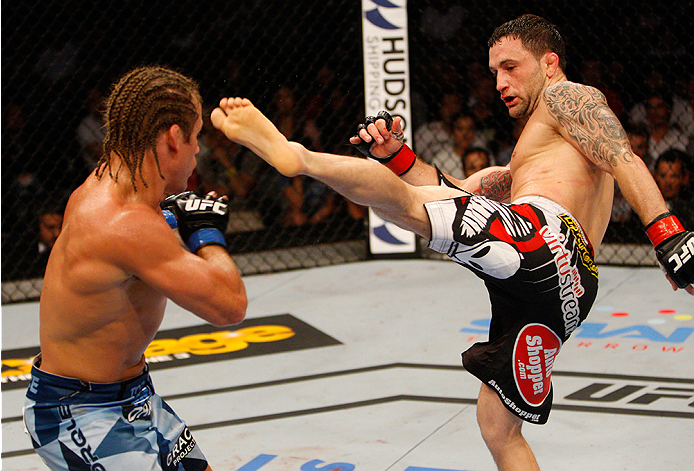 MANILA, PHILIPPINES - MAY 16: Frankie Edgar of the United States throws a kick at Uriah Faber of the United States in their featherweight fight during the UFC Fight Night event at the Mall of Asia Arena on May 16, 2015 in Manila, Philippines. (Photo by Mi