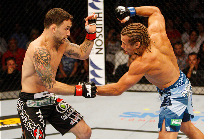 MANILA, PHILIPPINES - MAY 16: Uriah Faber of the United States throws a punch at Frankie Edgar of the United States in their featherweight fight during the UFC Fight Night event at the Mall of Asia Arena on May 16, 2015 in Manila, Philippines. (Photo by