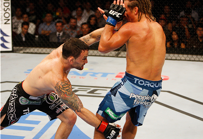 MANILA, PHILIPPINES - MAY 16: Frankie Edgar of the United States takes down Uriah Faber of the United States in their featherweight fight during the UFC Fight Night event at the Mall of Asia Arena on May 16, 2015 in Manila, Philippines. (Photo by Mitch V