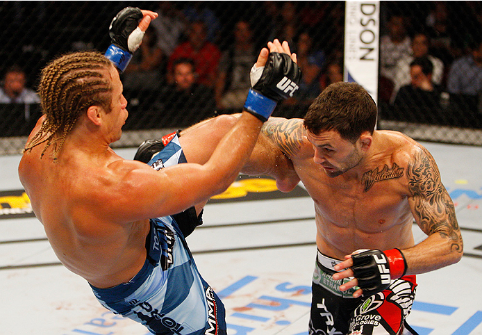 MANILA, PHILIPPINES - MAY 16: Frankie Edgar of the United States throws a punch at Uriah Faber of the United States in their featherweight fight during the UFC Fight Night event at the Mall of Asia Arena on May 16, 2015 in Manila, Philippines. (Photo by M