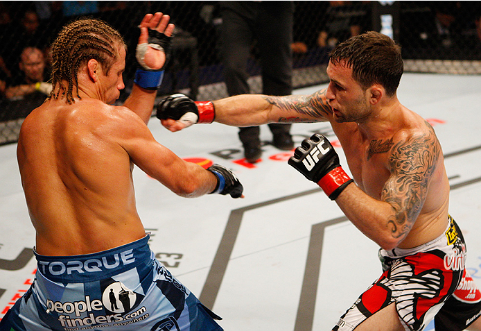 MANILA, PHILIPPINES - MAY 16: Frankie Edgar of the United States throws a punch at Uriah Faber of the United States in their featherweight fight during the UFC Fight Night event at the Mall of Asia Arena on May 16, 2015 in Manila, Philippines. (Photo by M