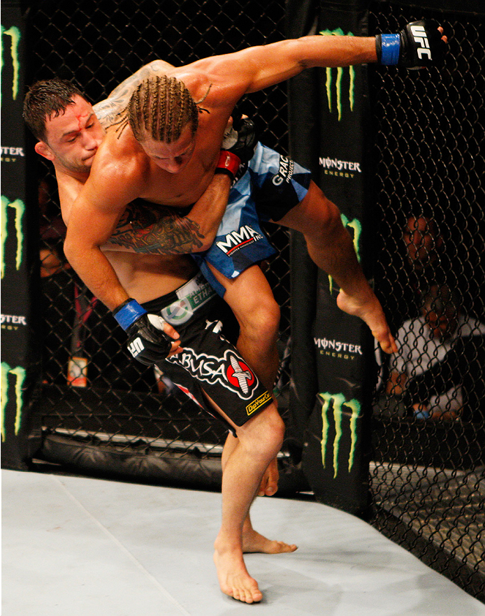 MANILA, PHILIPPINES - MAY 16: Frankie Edgar of the United States takes down Uriah Faber of the United States in their featherweight fight during the UFC Fight Night event at the Mall of Asia Arena on May 16, 2015 in Manila, Philippines. (Photo by Mitch V