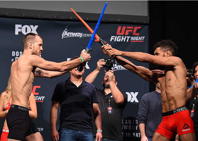 ORLANDO, FL - DECEMBER 18: (L-R) Opponents Cole Miller and Jim Alers face off during the UFC weigh-in at the Orange County Convention Center on December 18, 2015 in Orlando, Florida. (Photo by Josh Hedges/Zuffa LLC/Zuffa LLC via Getty Images)