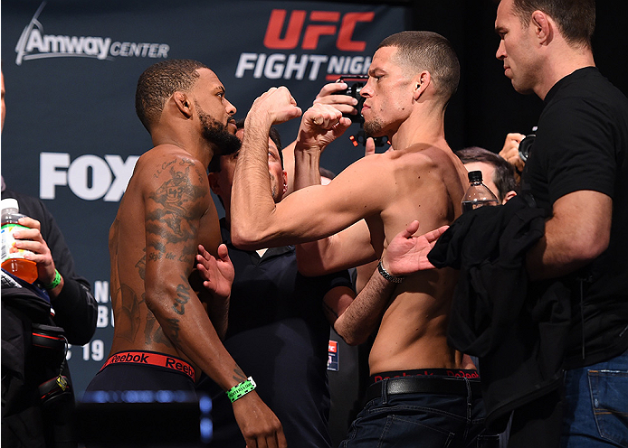 ORLANDO, FL - DECEMBER 18: (L-R) Opponents Michael Johnson and Nate Diaz face off during the UFC weigh-in at the Orange County Convention Center on December 18, 2015 in Orlando, Florida. (Photo by Josh Hedges/Zuffa LLC/Zuffa LLC via Getty Images)