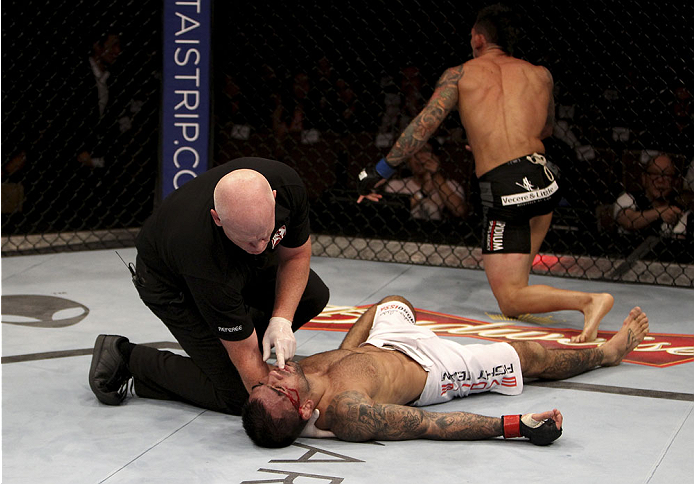 SINGAPORE - JANUARY 04: Russell Doane celebrates his win over Leandro Issa in their bantamweight bout during the UFC Fight Night event at the Marina Bay Sands Resort on January 4, 2014 in Singapore. (Photo by Mitch Viquez/Zuffa LLC/Zuffa LLC via Getty Im