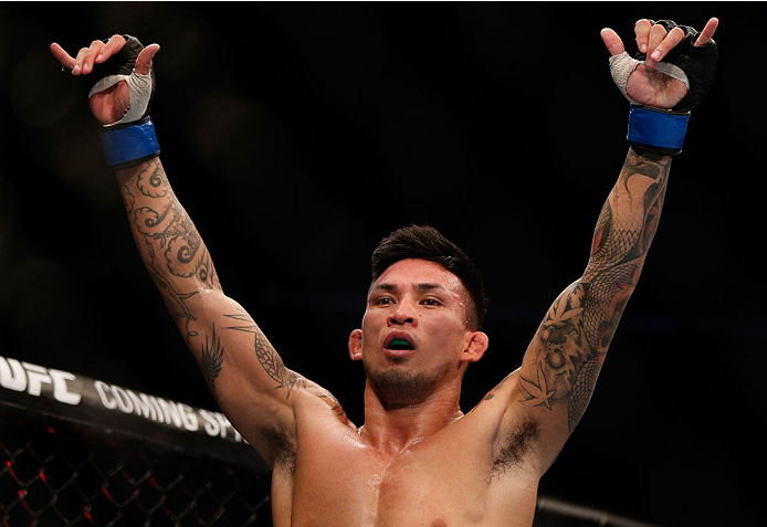 SINGAPORE - JANUARY 04: Russell Doane reacts after his submission victory over Leandro Issa in their bantamweight bout during the UFC Fight Night event at the Marina Bay Sands Resort on January 4, 2014 in Singapore. (Photo by Josh Hedges/Zuffa LLC/Zuffa