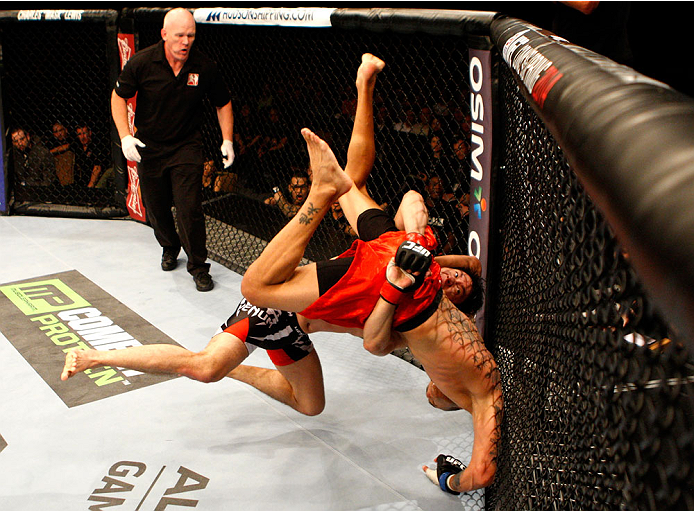 SINGAPORE - JANUARY 04: Royston Wee takes down David Galera in their bantamweight bout during the UFC Fight Night event at the Marina Bay Sands Resort on January 4, 2014 in Singapore. (Photo by Mitch Viquez/Zuffa LLC/Zuffa LLC via Getty Images)