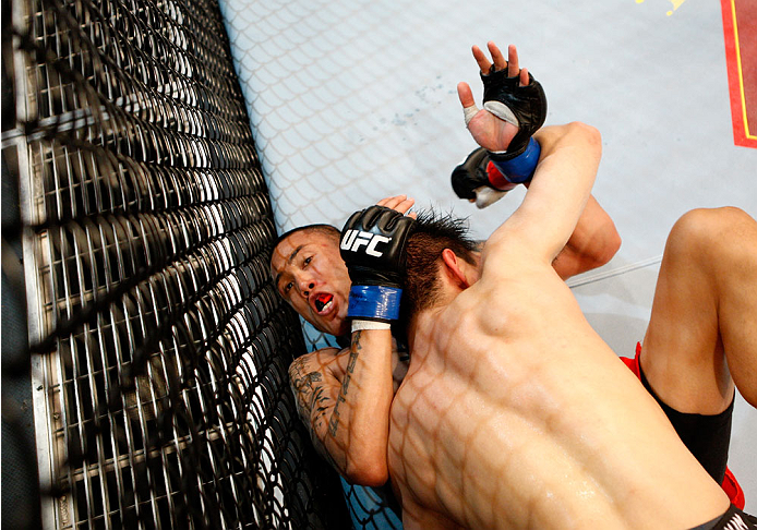 SINGAPORE - JANUARY 04: (L to R) David Galera and Royston Wee face off in their bantamweight bout during the UFC Fight Night event at the Marina Bay Sands Resort on January 4, 2014 in Singapore. (Photo by Mitch Viquez/Zuffa LLC/Zuffa LLC via Getty Images