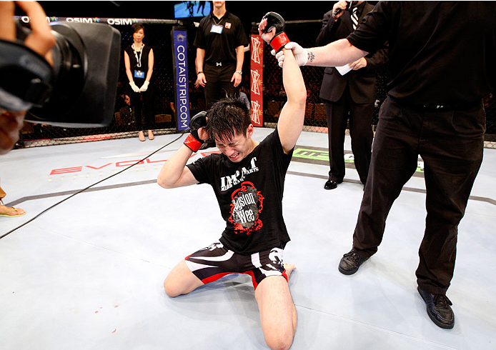 SINGAPORE - JANUARY 04: Royston Wee reacts after hearing he defeated David Galera in their bantamweight bout during the UFC Fight Night event at the Marina Bay Sands Resort on January 4, 2014 in Singapore. (Photo by Mitch Viquez/Zuffa LLC/Zuffa LLC via Ge