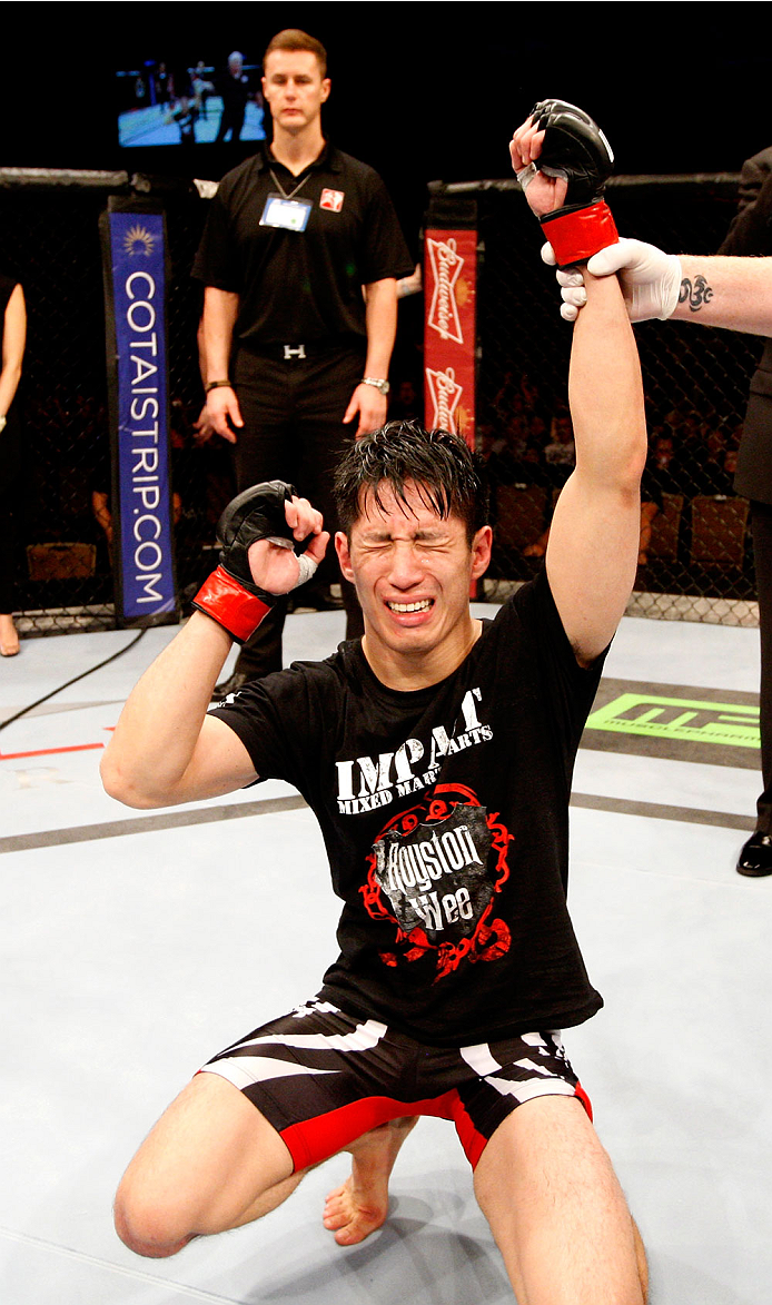 SINGAPORE - JANUARY 04: Royston Wee reacts after hearing he defeated David Galera in their bantamweight bout during the UFC Fight Night event at the Marina Bay Sands Resort on January 4, 2014 in Singapore. (Photo by Mitch Viquez/Zuffa LLC/Zuffa LLC via Ge