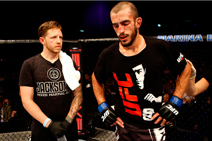 SINGAPORE - JANUARY 04: Quinn Mulhern waits for the decision in his lightweight bout with Katsunori Kikuno during the UFC Fight Night event at the Marina Bay Sands Resort on January 4, 2014 in Singapore. (Photo by Mitch Viquez/Zuffa LLC/Zuffa LLC via Get
