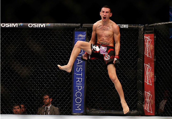 SINGAPORE - JANUARY 04: Max Holloway reacts after his TKO victory over Will Chope in their featherweight bout during the UFC Fight Night event at the Marina Bay Sands Resort on January 4, 2014 in Singapore. (Photo by Josh Hedges/Zuffa LLC/Zuffa LLC via G