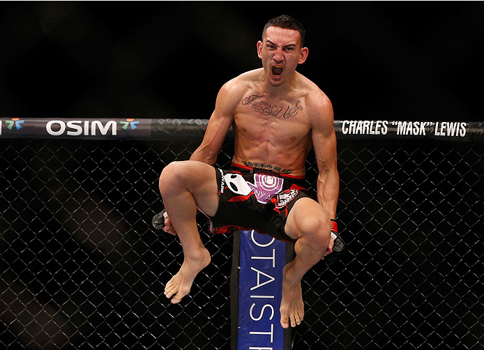 SINGAPORE - JANUARY 04: Max Holloway reacts after his TKO victory over Will Chope in their featherweight bout during the UFC Fight Night event at the Marina Bay Sands Resort on January 4, 2014 in Singapore. (Photo by Josh Hedges/Zuffa LLC/Zuffa LLC via G