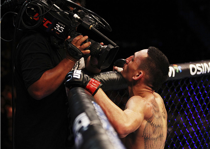 SINGAPORE - JANUARY 04: Max Holloway celebrates his win over Will Chope in their featherweight bout during the UFC Fight Night event at the Marina Bay Sands Resort on January 4, 2014 in Singapore. (Photo by Mitch Viquez/Zuffa LLC/Zuffa LLC via Getty Imag