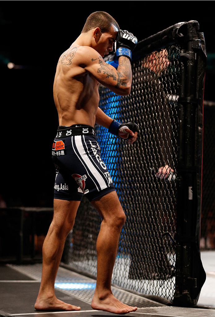 SINGAPORE - JANUARY 04: Sean Soriano enters the Octagon before his featherweight bout against Tatsuya Kawajiri during the UFC Fight Night event at the Marina Bay Sands Resort on January 4, 2014 in Singapore. (Photo by Josh Hedges/Zuffa LLC/Zuffa LLC via