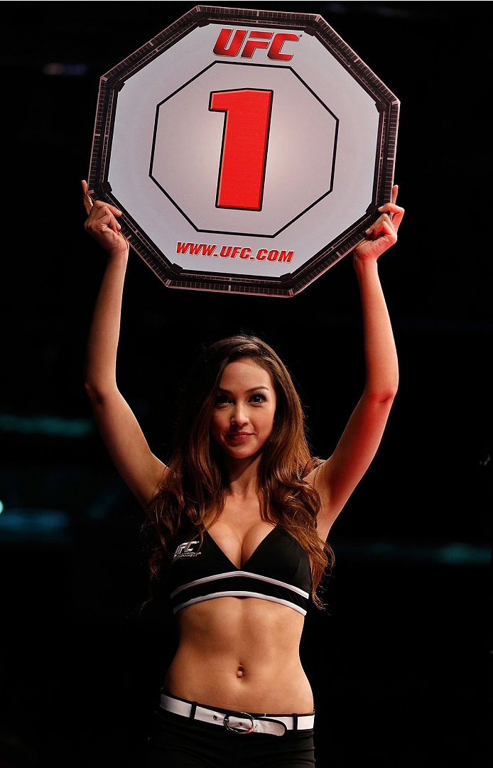 SINGAPORE - JANUARY 04: UFC Octagon Girl Jessica Cambensy introduces a round during the UFC Fight Night event at the Marina Bay Sands Resort on January 4, 2014 in Singapore. (Photo by Josh Hedges/Zuffa LLC/Zuffa LLC via Getty Images)