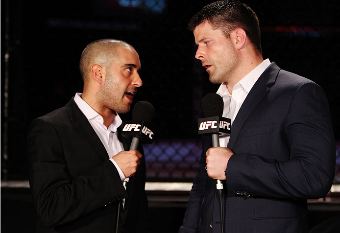 SINGAPORE - JANUARY 04: (L to R) Announcers Jon Anik and Brian Stann talk during the UFC Fight Night event at the Marina Bay Sands Resort on January 4, 2014 in Singapore. (Photo by Mitch Viquez/Zuffa LLC/Zuffa LLC via Getty Images)