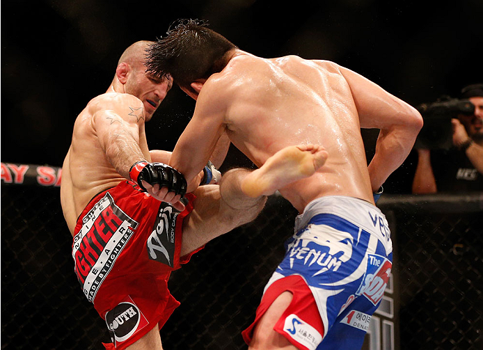 SINGAPORE - JANUARY 04: (L-R) Tarec Saffiedine kicks Lim Hyun Gyu in their welterweight bout during the UFC Fight Night event at the Marina Bay Sands Resort on January 4, 2014 in Singapore. (Photo by Josh Hedges/Zuffa LLC/Zuffa LLC via Getty Images)