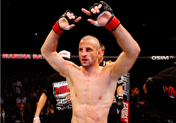 SINGAPORE - JANUARY 04: Tarec Saffiedine celebrates after his win over Lim Hyun Gyu in their welterweight bout during the UFC Fight Night event at the Marina Bay Sands Resort on January 4, 2014 in Singapore. (Photo by Mitch Viquez/Zuffa LLC/Zuffa LLC via