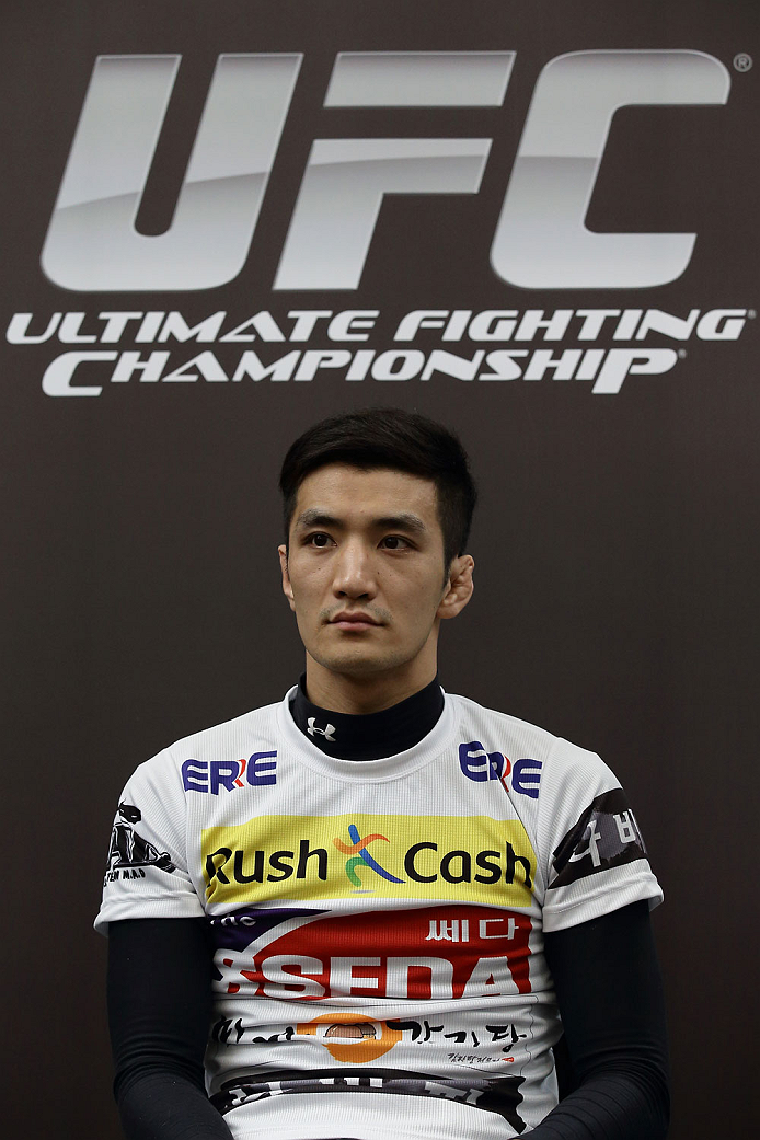 SINGAPORE - JANUARY 02: Kyung Ho Kang attends the UFC Fight Night Singapore Ultimate Media Day at the Skating Rink at The Shoppes at Marina Bay Sand on January 2, 2014 in Singapore. (Photo by Suhaimi Abdullah/Zuffa LLC)