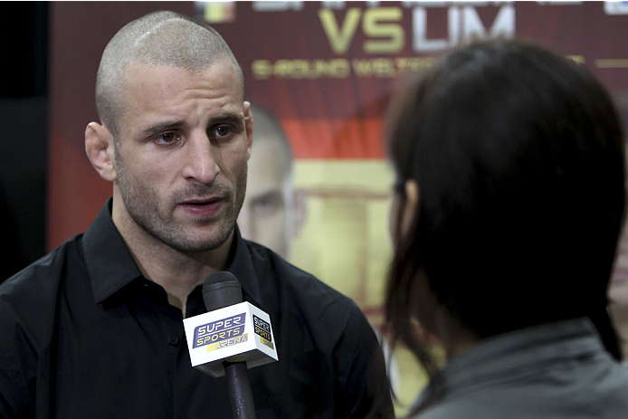 SINGAPORE - JANUARY 02: Tarec Saffiedine interacts with media during the UFC Fight Night Singapore Ultimate Media Day at the Shoppes at Marina Bay Sands on January 2, 2014 in Singapore. (Photo by Mitch Viquez/Zuffa LLC/Zuffa LLC via Getty Images)