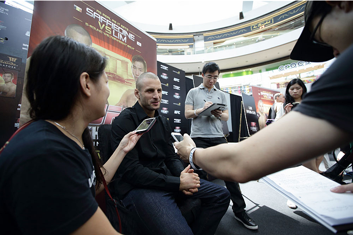 SINGAPORE - JANUARY 02: Tarec Saffiedine speaks to the media during the UFC Fight Night Singapore Ultimate Media Day at the Skating Rink at The Shoppes at Marina Bay Sand on January 2, 2014 in Singapore. (Photo by Suhaimi Abdullah/Zuffa LLC)