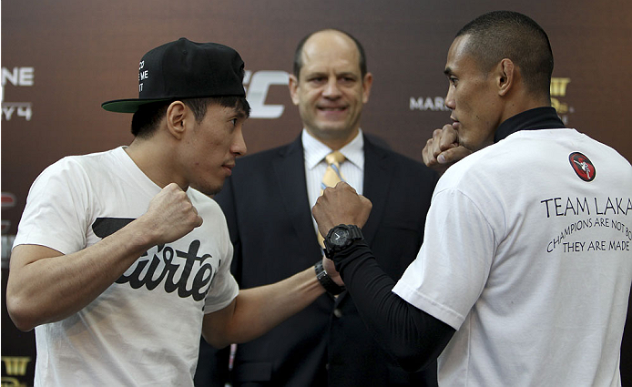 SINGAPORE - JANUARY 02: (L-R) Opponents Royston Wee and David Galera face off during the UFC Fight Night Singapore Ultimate Media Day at the Shoppes at Marina Bay Sands on January 2, 2014 in Singapore. (Photo by Mitch Viquez/Zuffa LLC/Zuffa LLC via Getty