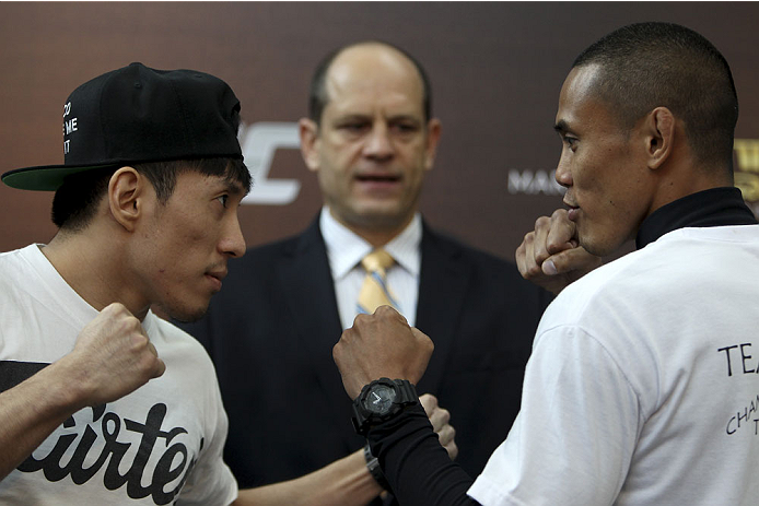SINGAPORE - JANUARY 02: (L-R) Opponents Royston Wee and David Galera face off during the UFC Fight Night Singapore Ultimate Media Day at the Shoppes at Marina Bay Sands on January 2, 2014 in Singapore. (Photo by Mitch Viquez/Zuffa LLC/Zuffa LLC via Getty