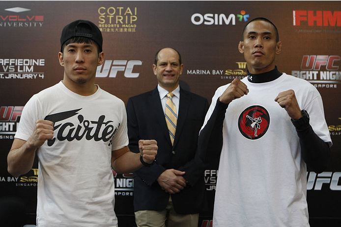 SINGAPORE - JANUARY 02: (L-R) Opponents Royston Wee and David Galera pose for photos during the UFC Fight Night Singapore Ultimate Media Day at the Shoppes at Marina Bay Sands on January 2, 2014 in Singapore. (Photo by Mitch Viquez/Zuffa LLC/Zuffa LLC vi