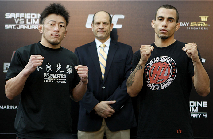 SINGAPORE - JANUARY 02: (L-R) Opponents Tatsuya Kawajiri and Sean Soriano pose for photos during the UFC Fight Night Singapore Ultimate Media Day at the Shoppes at Marina Bay Sands on January 2, 2014 in Singapore. (Photo by Mitch Viquez/Zuffa LLC/Zuffa L