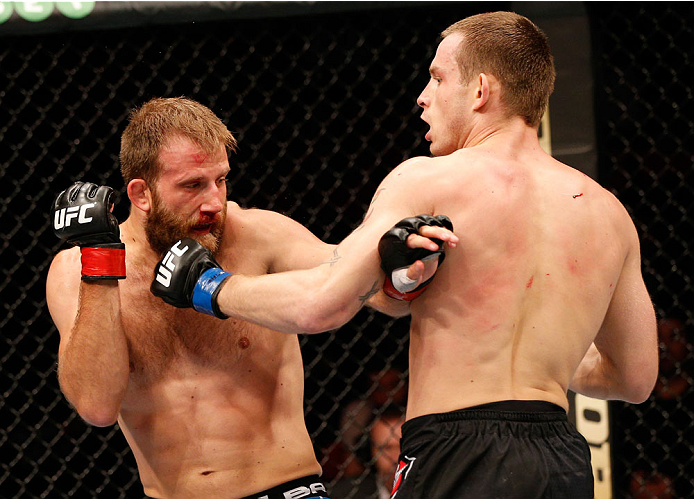 STOCKHOLM, SWEDEN - OCTOBER 04: (R-L) Krzysztof Jotko of Poland punches Tor Troeng of Sweden in their middleweight bout at the Ericsson Globe Arena on October 4, 2014 in Stockholm, Sweden. (Photo by Josh Hedges/Zuffa LLC/Zuffa LLC)