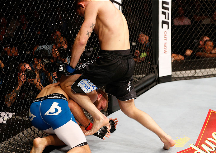 STOCKHOLM, SWEDEN - OCTOBER 04: (R-L) Krzysztof Jotko of Poland knees the body of Tor Troeng of Sweden in their middleweight bout at the Ericsson Globe Arena on October 4, 2014 in Stockholm, Sweden. (Photo by Josh Hedges/Zuffa LLC/Zuffa LLC)