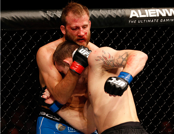 STOCKHOLM, SWEDEN - OCTOBER 04: (R-L) Krzysztof Jotko of Poland punches the body of Tor Troeng of Sweden in their middleweight bout at the Ericsson Globe Arena on October 4, 2014 in Stockholm, Sweden. (Photo by Josh Hedges/Zuffa LLC/Zuffa LLC)