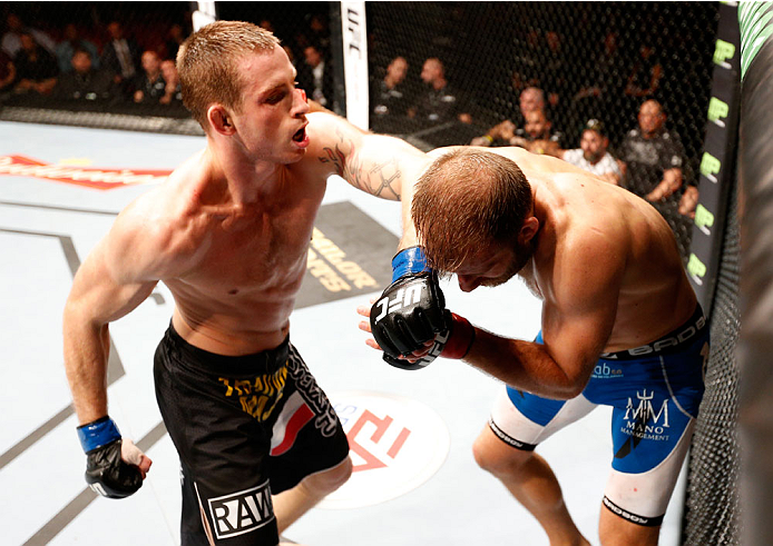 STOCKHOLM, SWEDEN - OCTOBER 04: (L-R) Krzysztof Jotko of Poland punches Tor Troeng of Sweden in their middleweight bout at the Ericsson Globe Arena on October 4, 2014 in Stockholm, Sweden. (Photo by Josh Hedges/Zuffa LLC/Zuffa LLC)