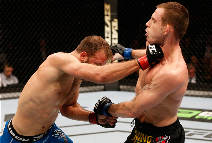 STOCKHOLM, SWEDEN - OCTOBER 04: (L-R) Tor Troeng of Sweden punches Krzysztof Jotko of Poland in their middleweight bout at the Ericsson Globe Arena on October 4, 2014 in Stockholm, Sweden. (Photo by Josh Hedges/Zuffa LLC/Zuffa LLC)